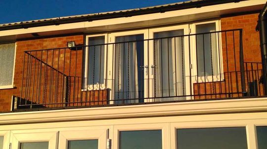 sunset and metal balcony